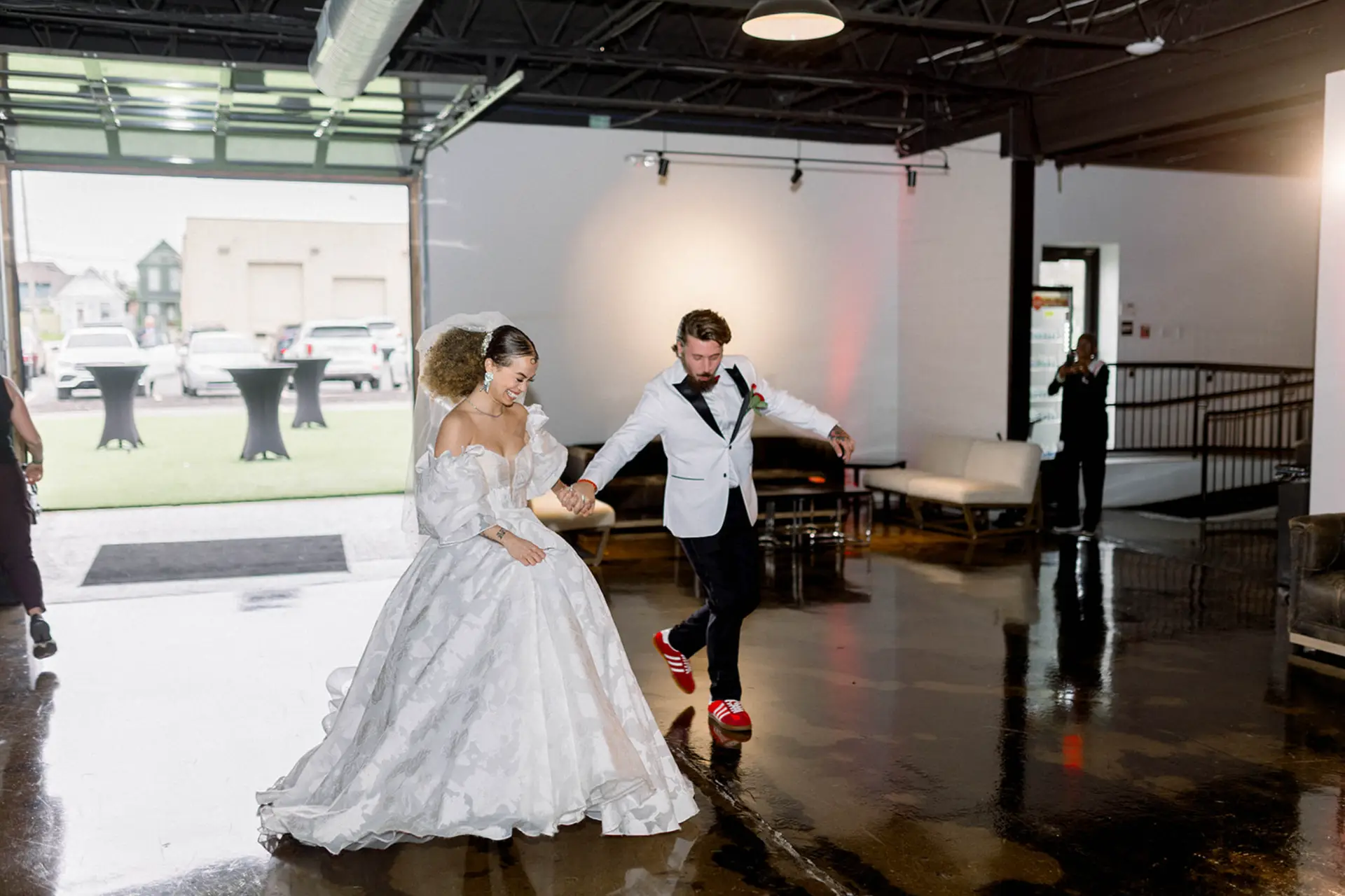 Bride and groom making their reception entrance at Radius, an Indianapolis wedding venue